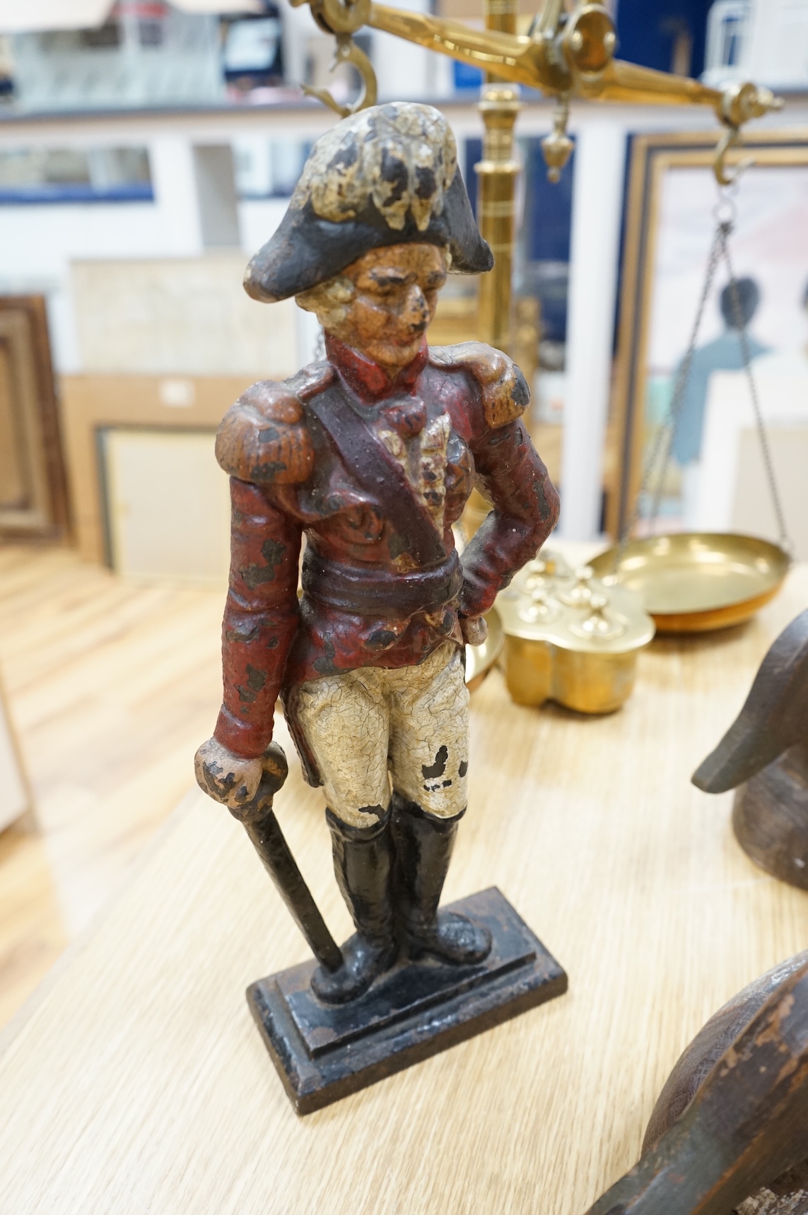 A cast iron ‘Admiral’ door-stop and two wooden decoy ducks, door stop 35cm high